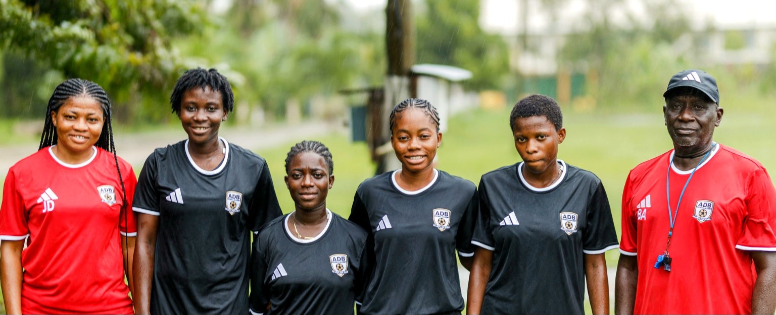 ADB Football Academy players together on the football pitch